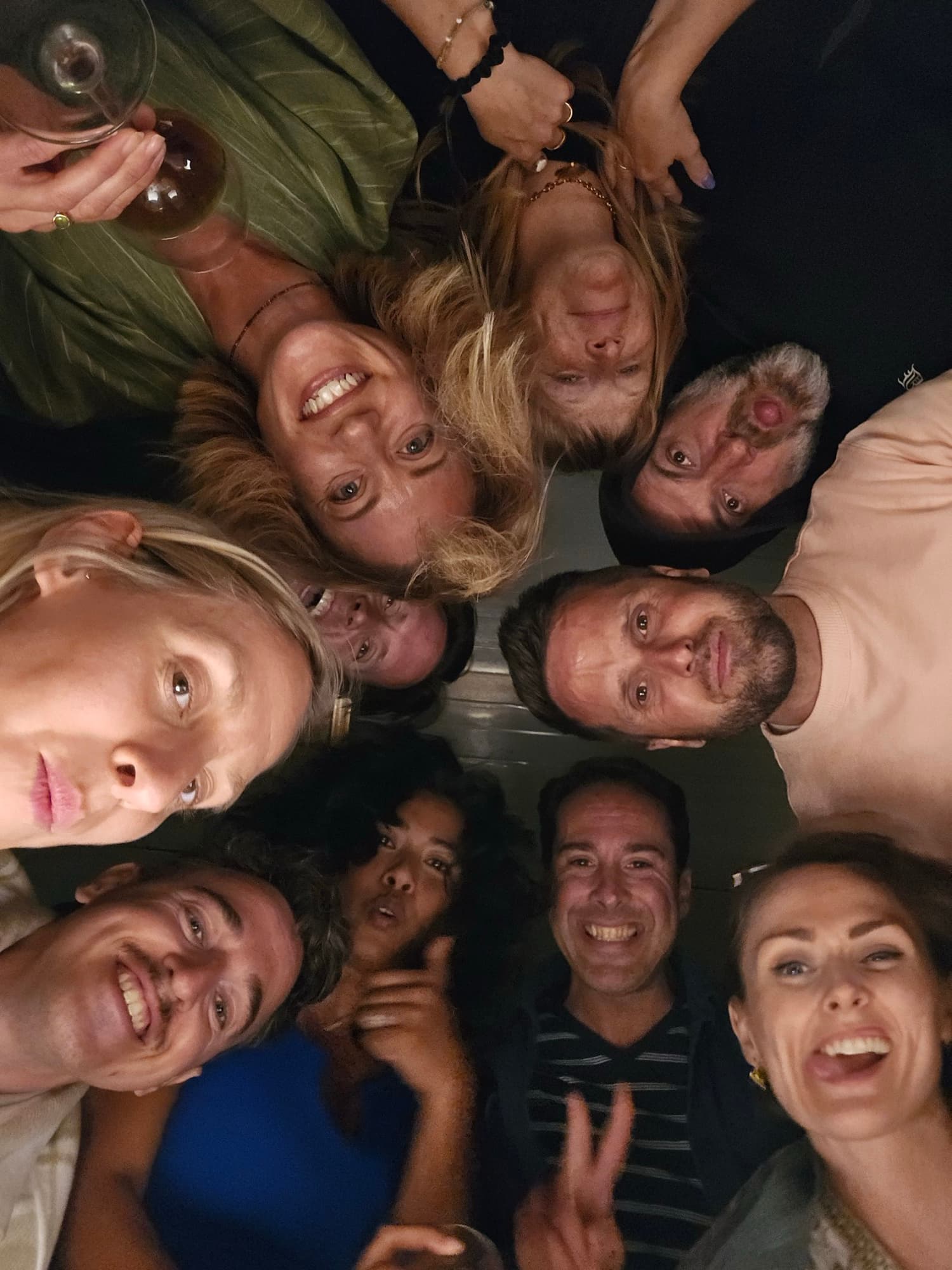 Friends leaning into a circle, belonging up close